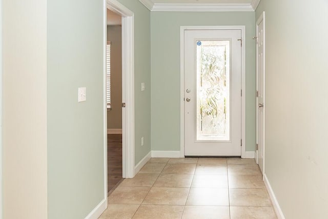 doorway with crown molding and light tile patterned floors