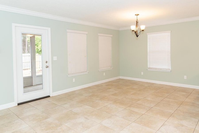 unfurnished room featuring ornamental molding and a chandelier