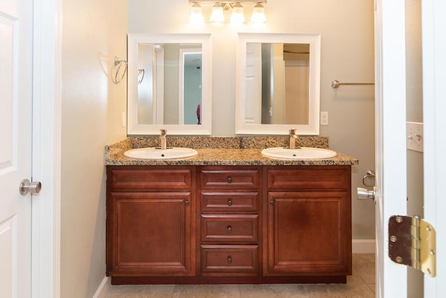 bathroom with tile patterned flooring and vanity