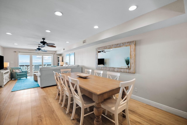 dining space with visible vents, recessed lighting, light wood-style floors, and baseboards