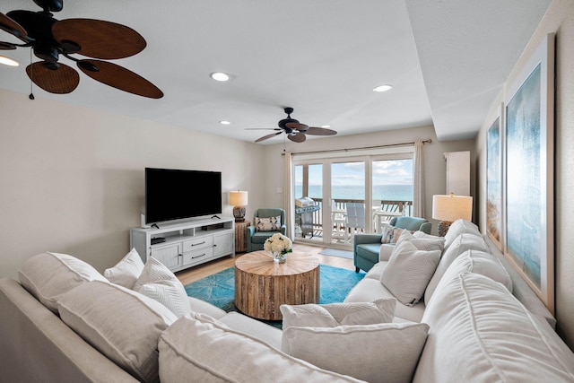 living area with recessed lighting and light wood-type flooring