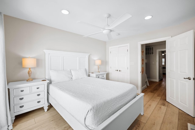 bedroom with recessed lighting, light wood-type flooring, a closet, and ceiling fan