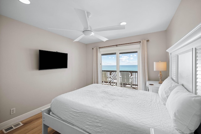 bedroom with visible vents, ceiling fan, baseboards, wood finished floors, and access to outside