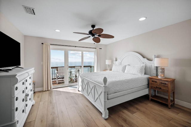 bedroom with visible vents, baseboards, light wood-style floors, and access to outside