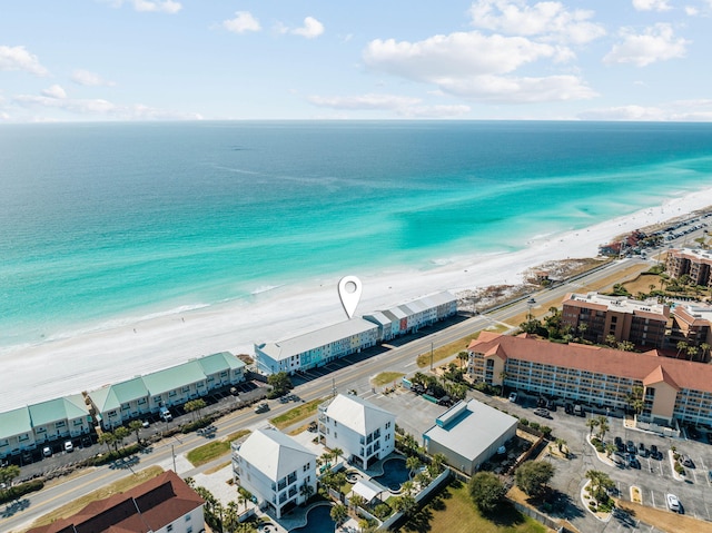 bird's eye view with a beach view and a water view