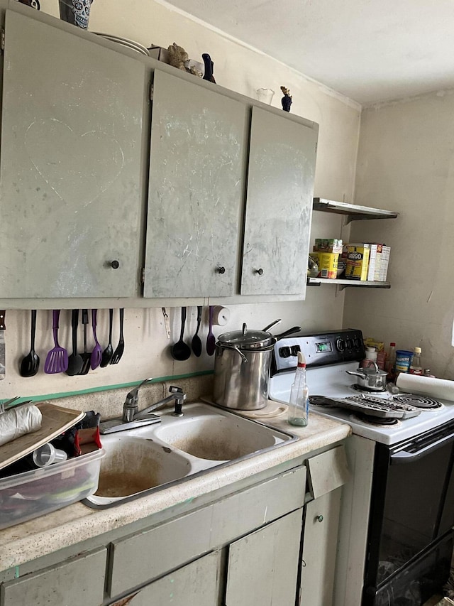 kitchen with sink and white electric range oven