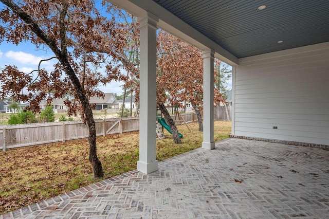 view of patio featuring a playground