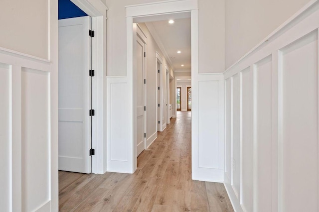 hall with light hardwood / wood-style flooring