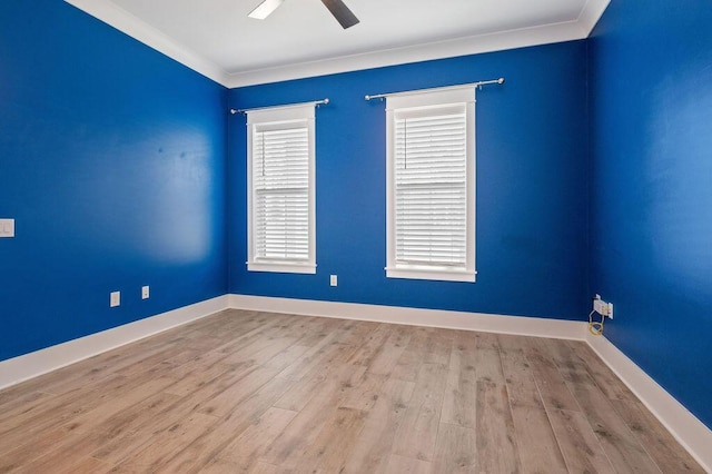 empty room with crown molding, ceiling fan, and light hardwood / wood-style flooring