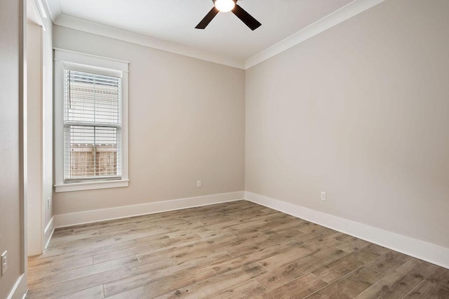 empty room featuring crown molding, ceiling fan, and light wood-type flooring