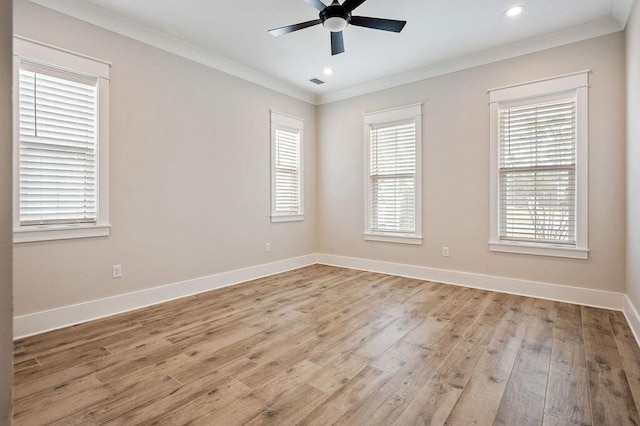 empty room featuring ornamental molding, ceiling fan, and light hardwood / wood-style floors