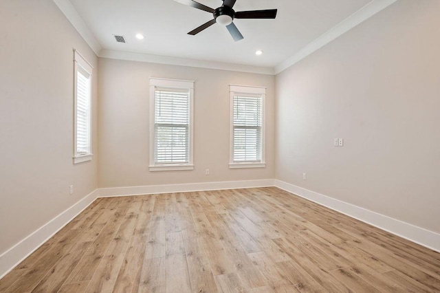 spare room with ornamental molding, ceiling fan, and light hardwood / wood-style flooring