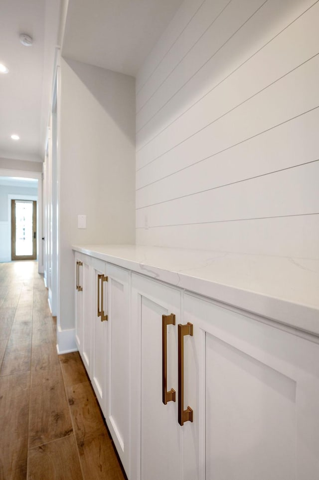 hall with dark hardwood / wood-style flooring