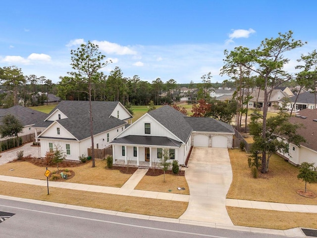 modern farmhouse style home with a porch, a garage, and a front yard