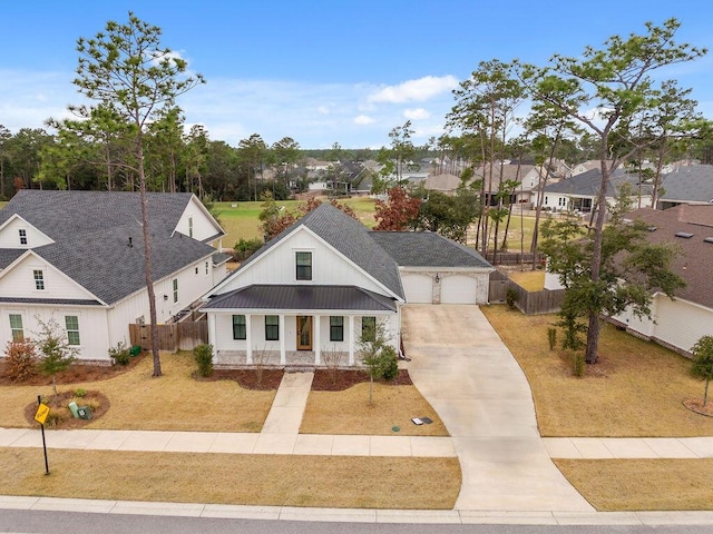 modern farmhouse style home with a garage and a front yard