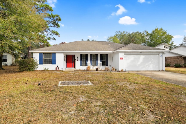 single story home featuring a garage and a front yard