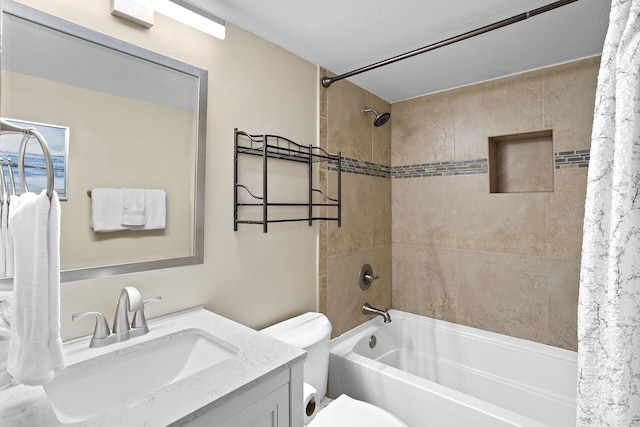 full bathroom featuring shower / tub combo, vanity, and toilet