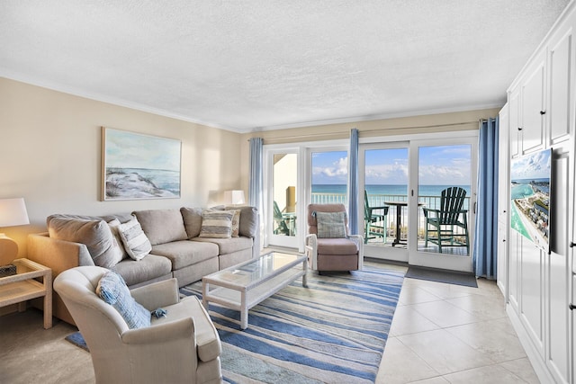 living area featuring a water view, crown molding, a textured ceiling, and light tile patterned floors