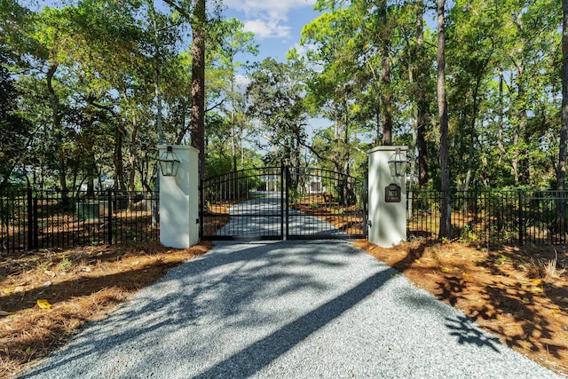 view of gate featuring fence