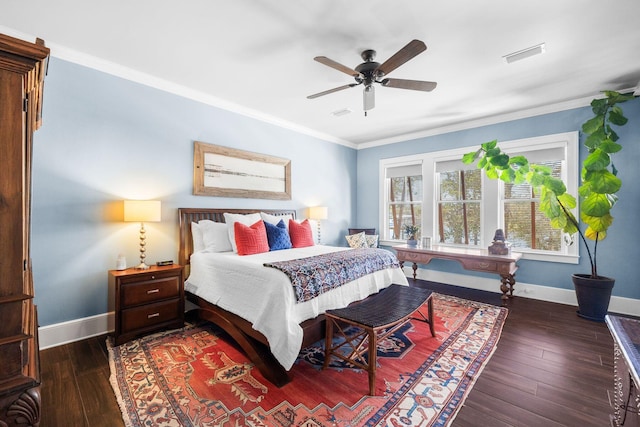 bedroom featuring ornamental molding, hardwood / wood-style floors, visible vents, and baseboards