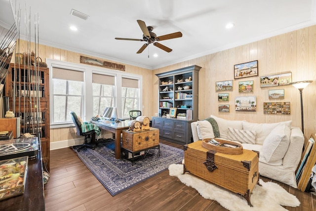 office space with a ceiling fan, visible vents, crown molding, and wood finished floors