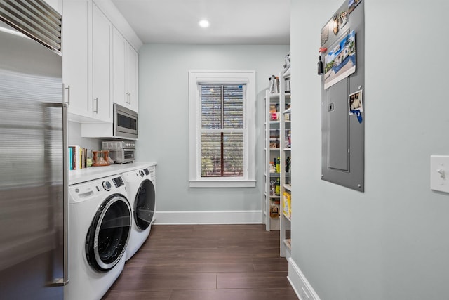 laundry area with recessed lighting, dark wood-type flooring, baseboards, cabinet space, and washing machine and clothes dryer