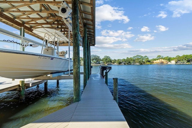 view of dock with a water view and boat lift