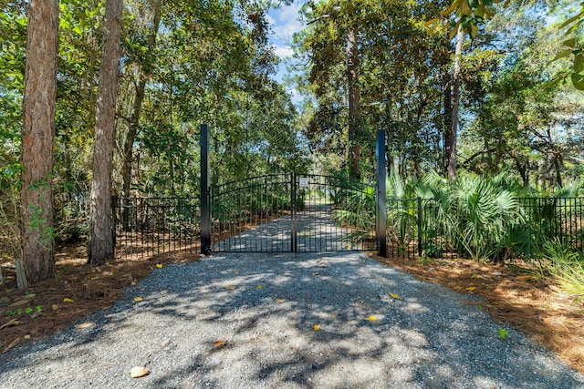 view of gate with fence