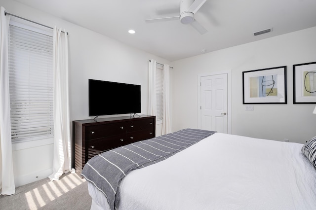 carpeted bedroom with ceiling fan