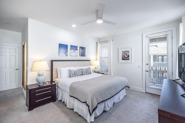 bedroom with light carpet, access to exterior, and multiple windows