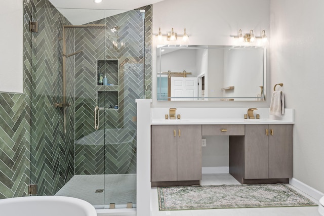 bathroom featuring double vanity, a stall shower, baseboards, a soaking tub, and a sink