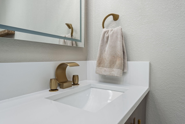 room details with a textured wall and vanity