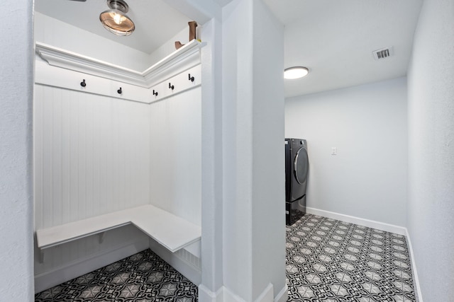 mudroom featuring visible vents, tile patterned floors, washer / dryer, and baseboards