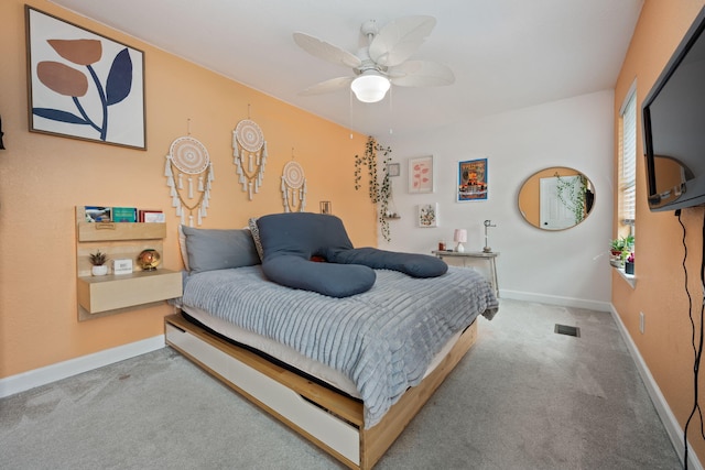 bedroom featuring a ceiling fan, carpet, visible vents, and baseboards