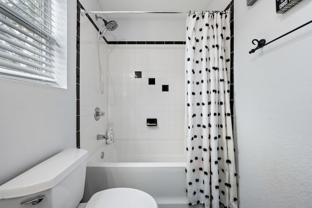 full bathroom featuring toilet and shower / bath combo with shower curtain