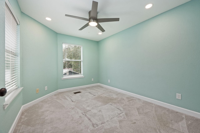 carpeted spare room with baseboards, visible vents, ceiling fan, and recessed lighting