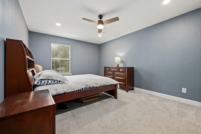 bedroom with baseboards, recessed lighting, a ceiling fan, and light colored carpet