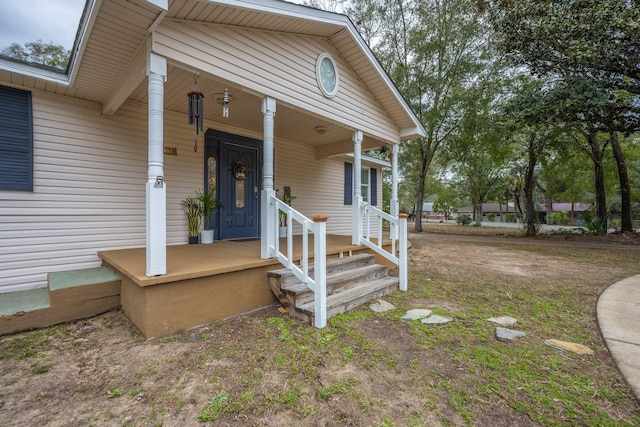 view of exterior entry featuring a porch