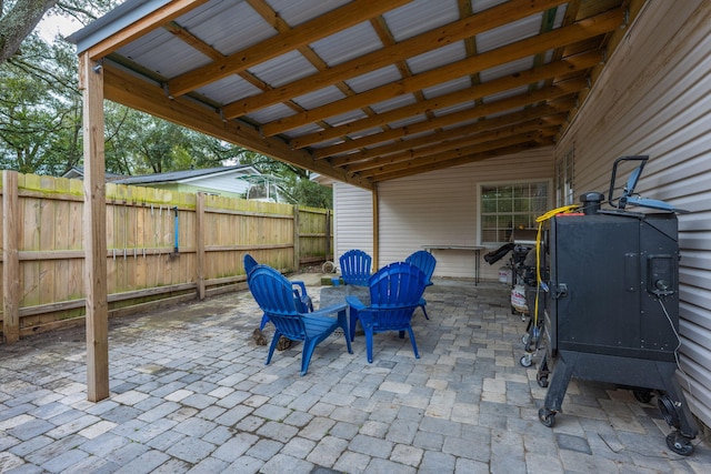 view of patio featuring fence