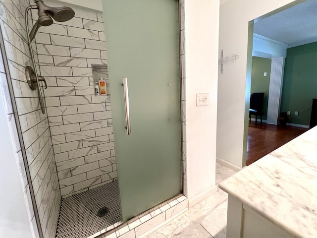 bathroom featuring an enclosed shower and vanity