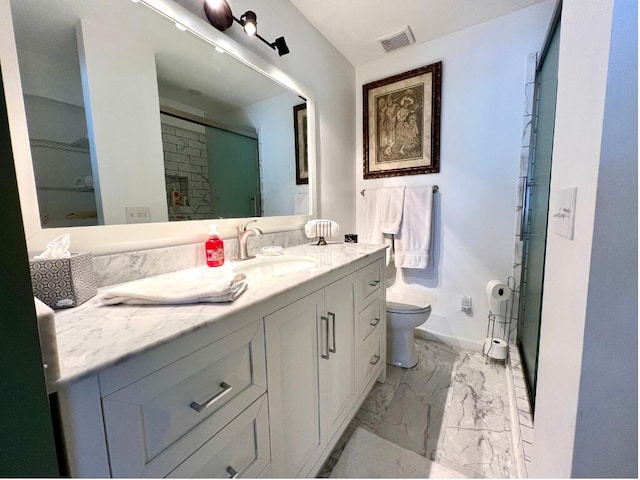 bathroom with vanity, an enclosed shower, and toilet