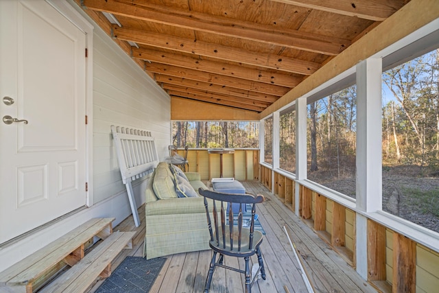 sunroom / solarium with lofted ceiling and wood ceiling