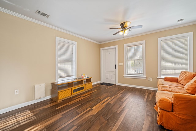 entrance foyer with ceiling fan, visible vents, baseboards, ornamental molding, and dark wood-style floors