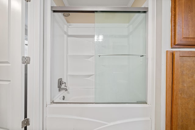 full bath featuring shower / bath combination with glass door