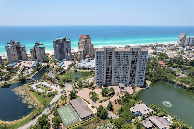 birds eye view of property featuring a water view and a view of city