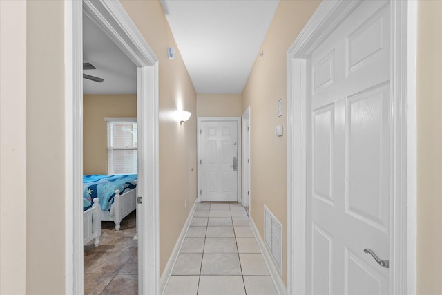 hallway with light tile patterned flooring