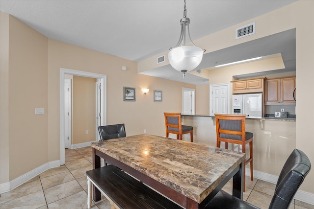 dining room with light tile patterned flooring