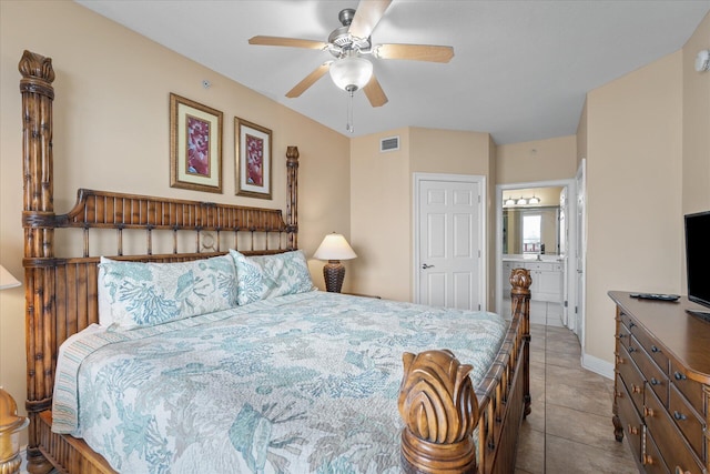 bedroom featuring connected bathroom and light tile patterned floors