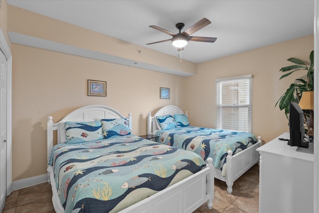 bedroom with light tile patterned floors and ceiling fan