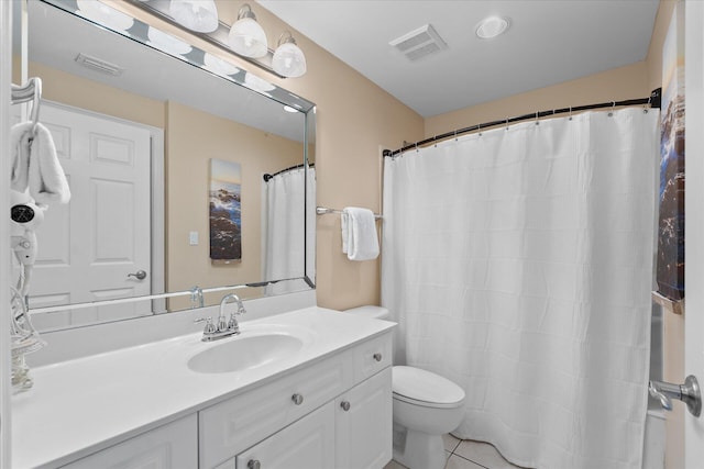 bathroom with walk in shower, vanity, toilet, and tile patterned flooring